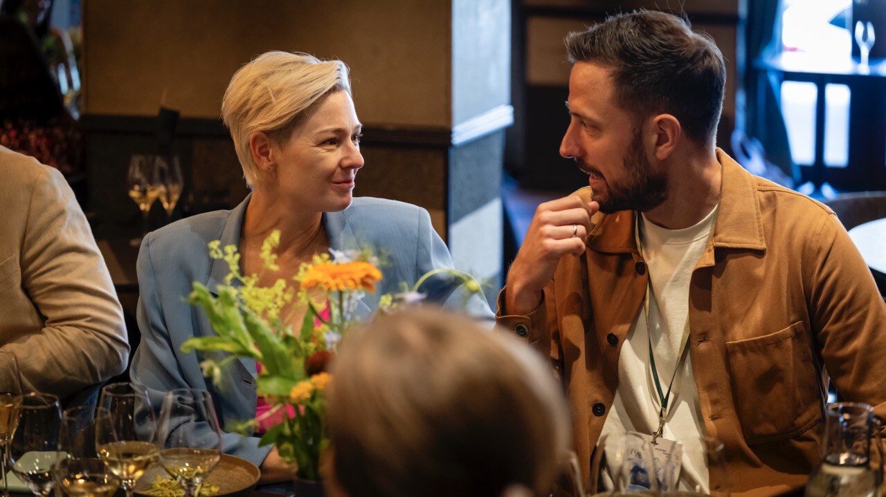 Image of Brooke Roberts-Islam (left) in a light blue blazer
